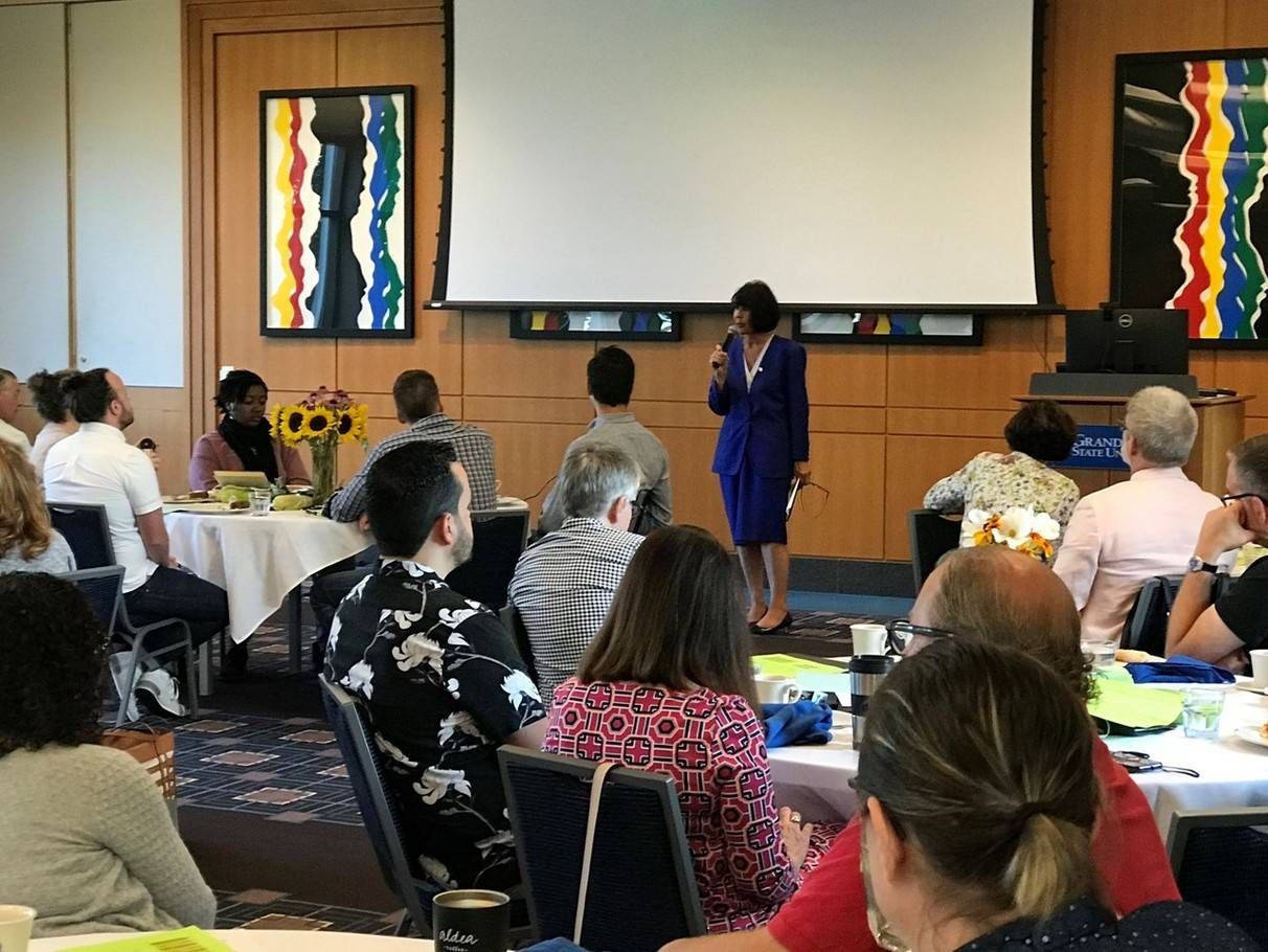 President Mantella speaking in front of the Brooks College faculty and staff